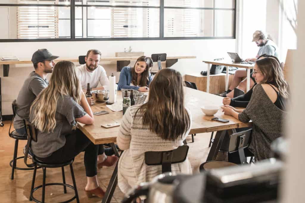 Group of coworkers sitting at table having a meeting