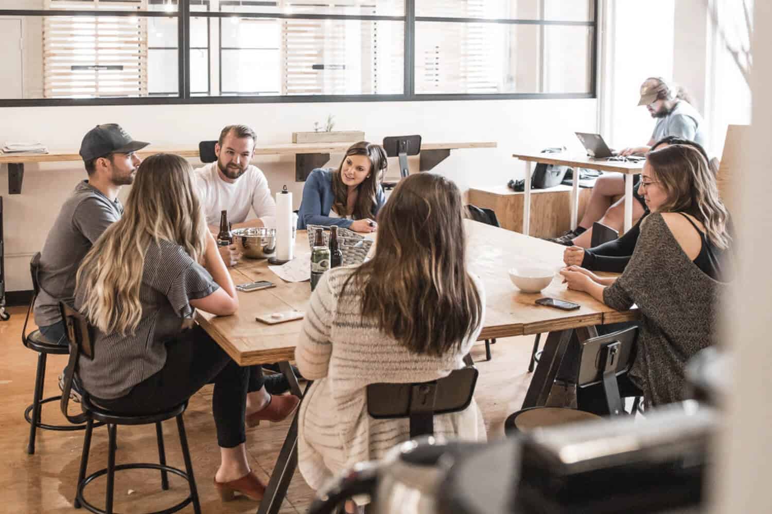 Group of coworkers sitting at table having a meeting