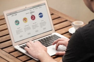 person viewing website landing page on laptop
