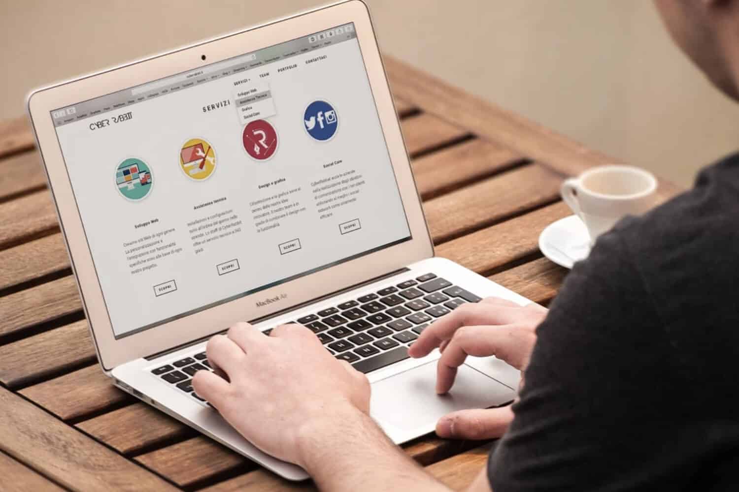 person viewing website landing page on laptop