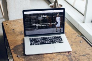 Laptop on a table with website landing page open