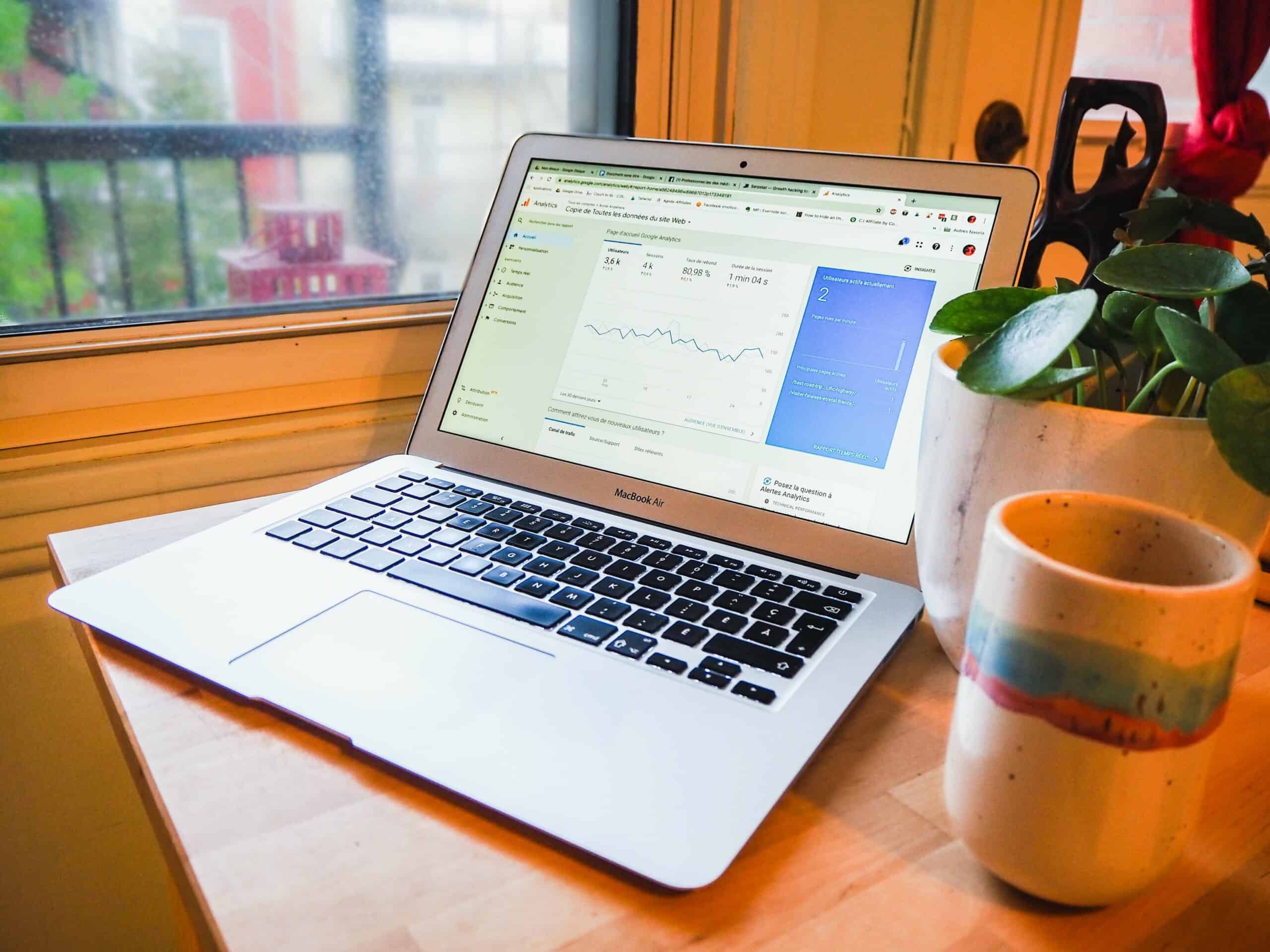 Laptop on table showing Google analytics page