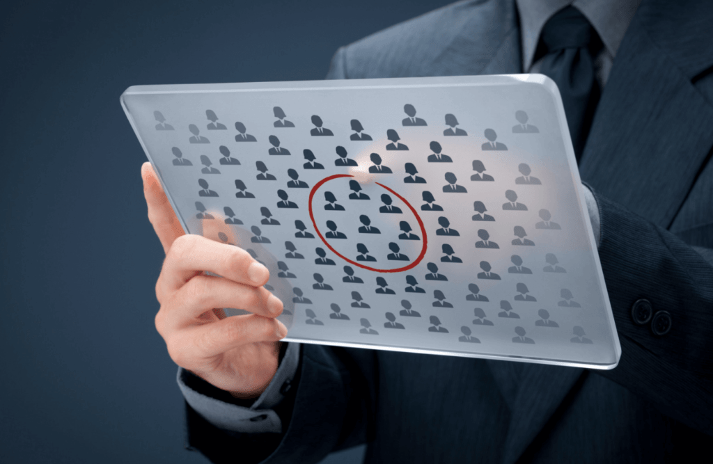 Person drawing circle around customer illustrations on tablet